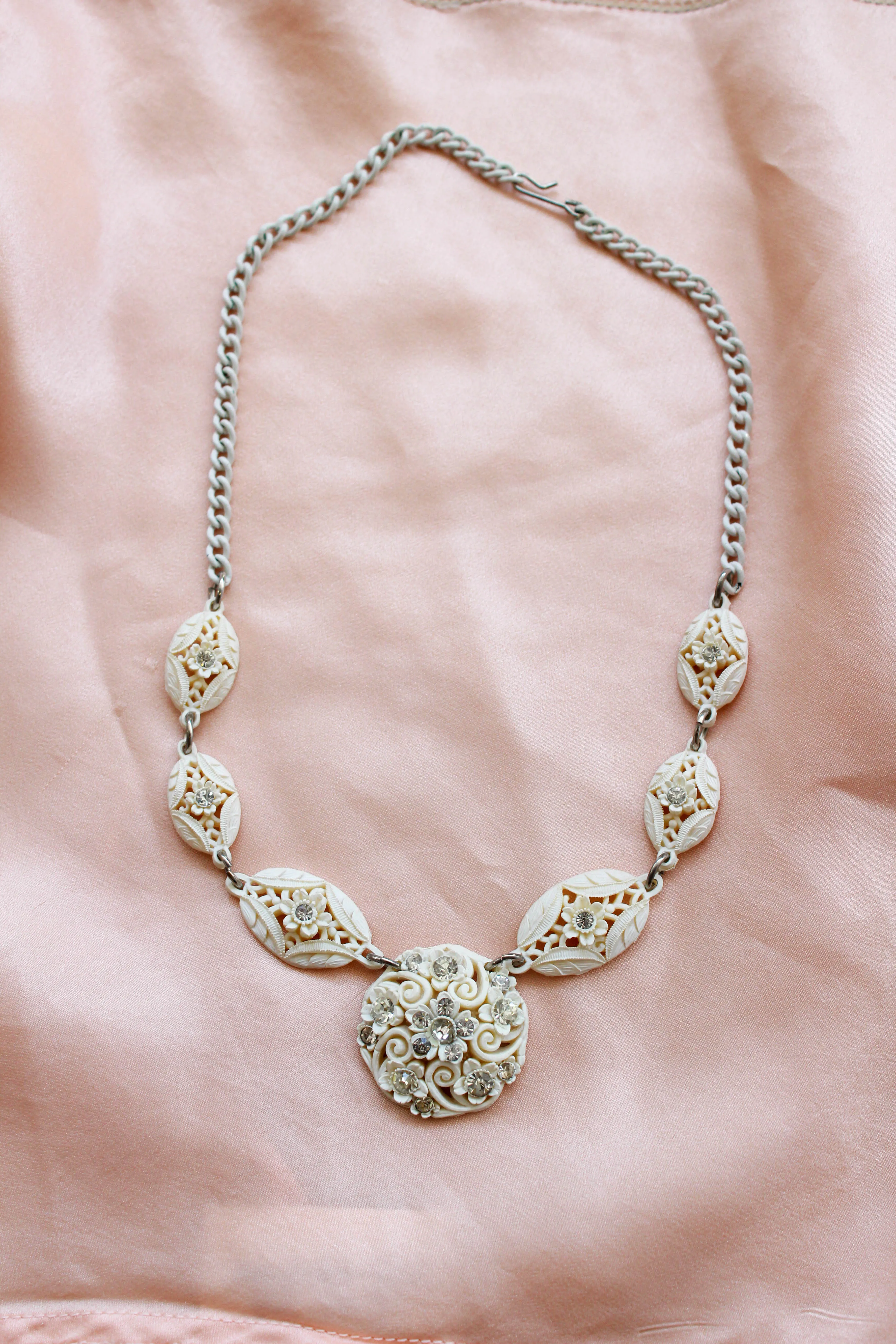 1950s White Carved Celluloid Rhinestone Necklace