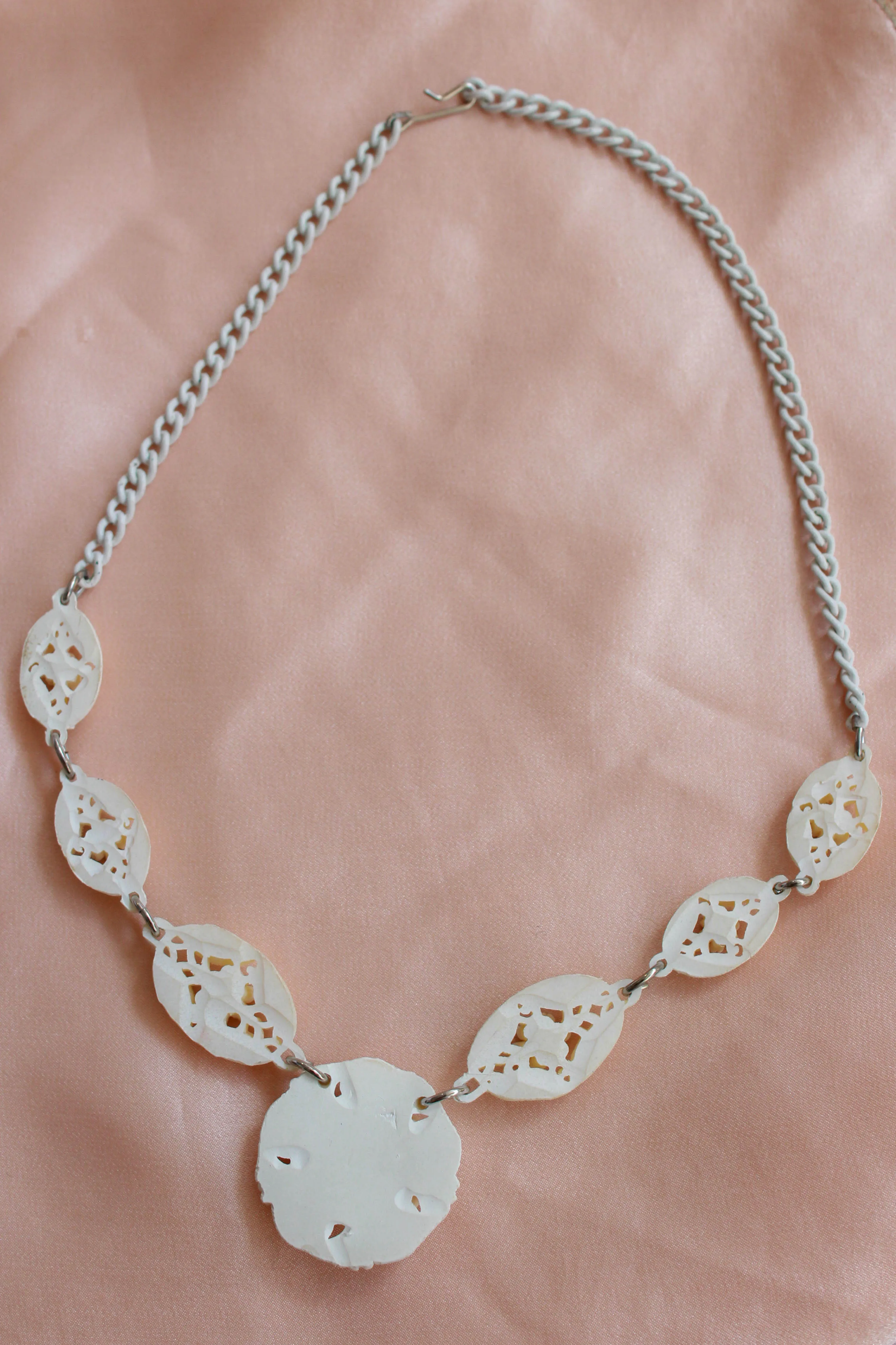 1950s White Carved Celluloid Rhinestone Necklace